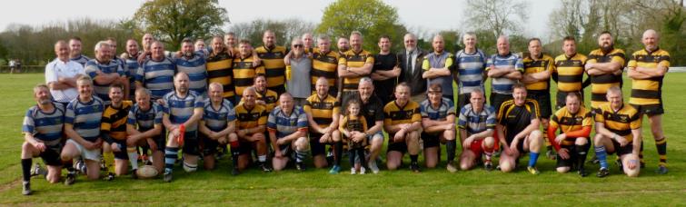 Both teams are pictured after the charity game